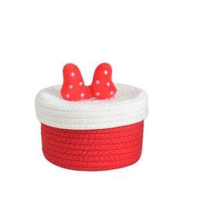 Cartoon style red and white cotton rope storage basket with a polka dot bow lid