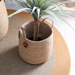 Minimalist woven seagrass planter with heart leather detail and waterproof liner