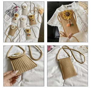 Detail view of woven straw crossbody bags with sunflower charms and tassel accents