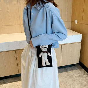 Women's black straw woven phone bag with a cute white plush bear charm detail