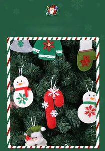 Close-up of assorted felt Christmas tree ornaments with festive snowman and reindeer motifs