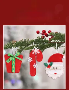 Felt Christmas ornaments featuring Santa Claus, candy cane, and gift box on pine branches