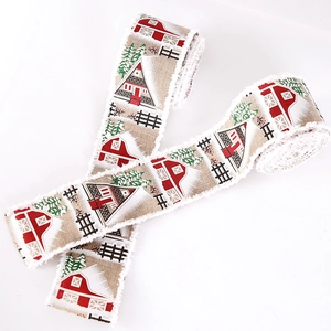 Rustic Christmas burlap ribbon featuring red barn and snow-covered trees on white background