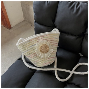 Macro view of woven bucket bag featuring 3D sunflower and colorful wavy stitching detail