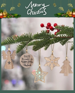Close-up of wooden Christmas ornaments with snowflake and star shapes on pine branches