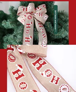 Detail of Christmas burlap ribbon with HO HO HO glitter print for DIY gift wrapping