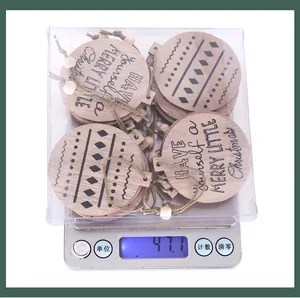 Detailed view of wooden Christmas ornaments set in packaging weighing 47.1g