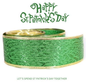 Detailed view of green St. Patrick's Day ribbon with gold edges and shiny glitter texture