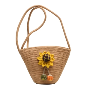 Sweet straw woven bucket bag with sunflower decoration and colorful plush ball pendants