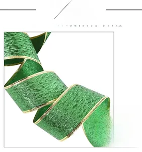 Detail view of green metallic Saint Patrick's ribbon with gold edges and glitter texture