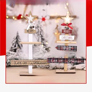 Detail of DIY wooden Christmas tree ornaments with festive bows and rustic star toppers
