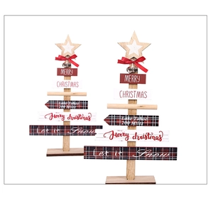Detail of wooden Christmas tree decor with red plaid patterns and festive lettering