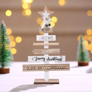 Close-up of DIY wooden Christmas tree decor with bells and Merry Christmas text