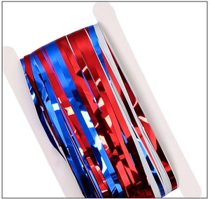 Detail of red white and blue metallic fringe garland wrapped on a card for Independence Day