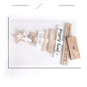 Flat lay of DIY wooden Christmas tree parts in packaging with Merry Christmas text
