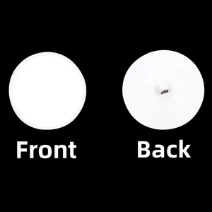 Macro detail of round white plastic ceiling hook showing both front and back sides clearly