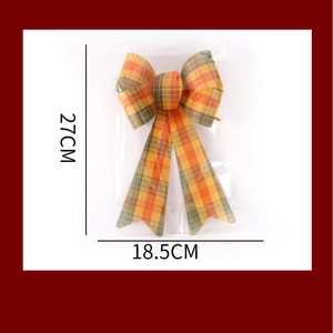 Detailed view showing the 27x18.5cm dimensions of the plaid Christmas bow ornament