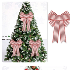 Detail of red and white striped Christmas bow ornaments for tree decorations