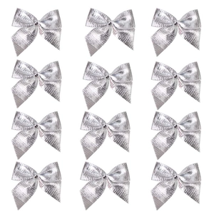 Close-up of 12 silver shiny bows for Christmas tree decoration and festive party layout