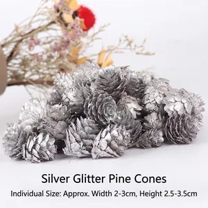 Silver glittered natural pine cones for Christmas tree decorations and festive photography props