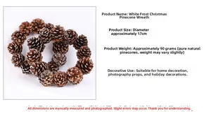Detailed view of white frosted Christmas pine cone wreath with 17cm diameter specifications