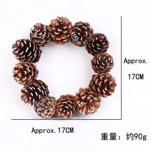 Natural pine cone Christmas wreath with white snow frost finish and 17cm outer diameter