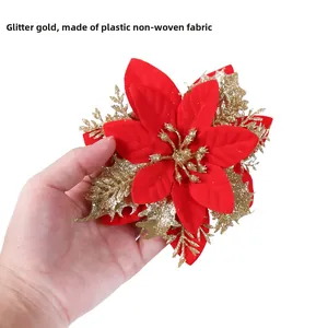 Detail of 14cm red artificial Christmas flower with gold glitter and non-woven fabric texture