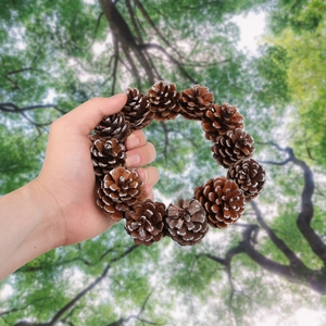 Natural pine cone wreath with snow effect for Christmas party and holiday wall decoration
