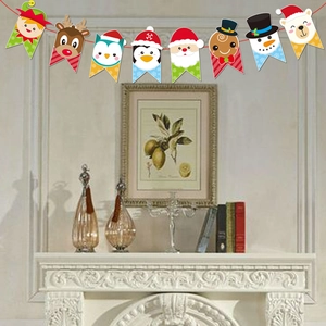 Detail of colorful Christmas cartoon banner featuring Santa and reindeer on white fireplace