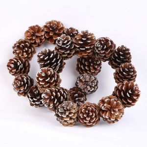 Natural pine cone Christmas wreath with silver accents for festive holiday decor