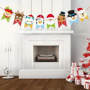 Close-up of colorful Christmas banner with cartoon reindeer and Santa Claus hanging on fireplace