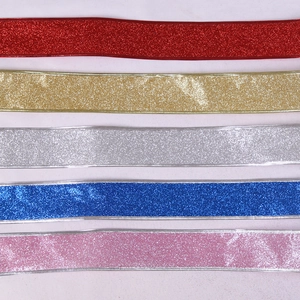 Close-up of glitter ribbon in red gold silver blue and pink for Christmas decoration