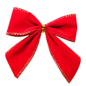 Close-up of a red velvet Christmas bow with gold wire edges and central metallic band
