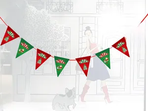 Close-up of Merry Christmas triangle banners with festive Santa and snowman prints