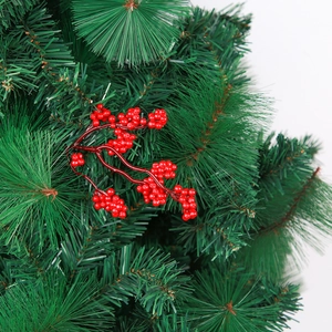 Close-up of glossy red Christmas berries nestled in green artificial pine branches