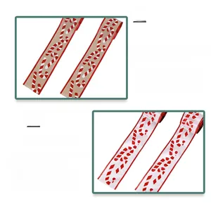 Detail view of 6.3cm Christmas ribbons with candy cane patterns and stitched edges