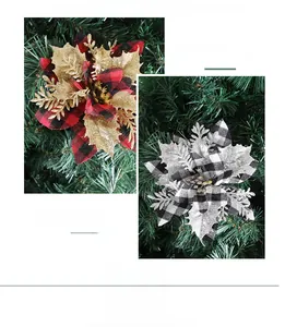 Close-up of red and black plaid Christmas flowers with gold glitter edges for tree decor