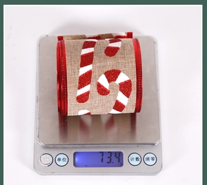Weight measurement of 6.3cm burlap Christmas ribbon with glitter candy cane patterns