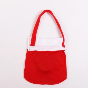 Detail of red and white Christmas candy bag with red fabric handle and white stitching