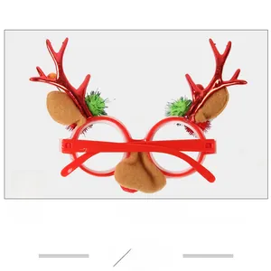 Macro view of Christmas reindeer antler glasses with plush ears and festive pom-poms