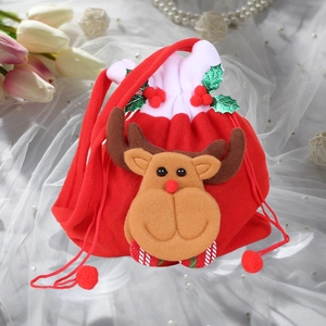 Detail of Christmas reindeer drawstring bag made of red non-woven fabric with holly decor