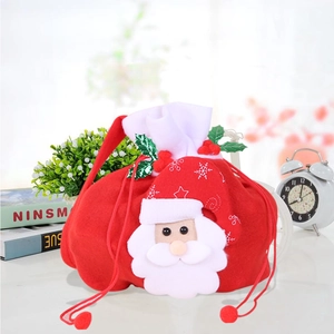 Detail of red felt Christmas gift bag with 3D Santa Claus and drawstring closure