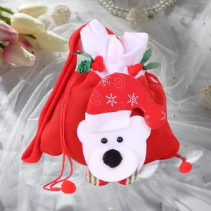 Detailed view of red plush Christmas drawstring gift bag with a 3D white polar bear figure