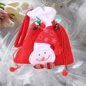 Close-up of festive Christmas drawstring gift bag with a 3D snowman and holly detail