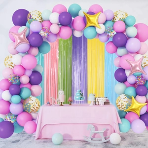 Colorful macaron balloon arch with metallic tinsel fringe curtains for birthday party decor