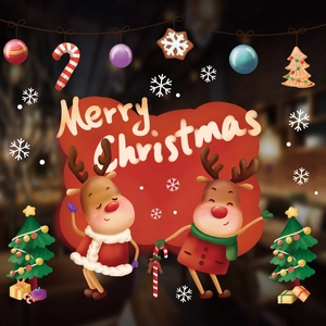 Detail of Christmas window stickers with cartoon reindeer, trees and Merry Christmas text