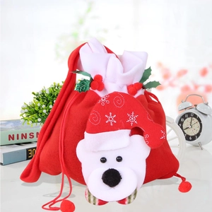 Detail of Christmas gift bag with 3D polar bear patch and red felt fabric texture