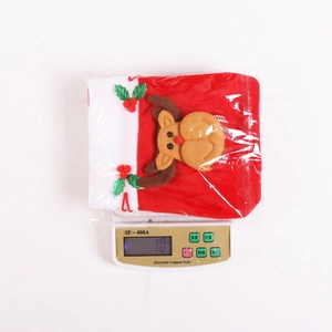 Detailed view of a plush reindeer Christmas gift bag showing the weight on a digital scale