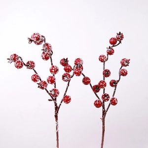 Artificial red berry branches with snow frosting for Christmas tree and festive decor