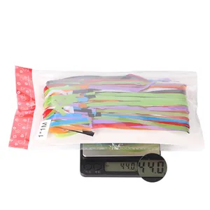 Weight measurement of 1x1M rainbow tinsel curtain in package showing 44 grams on scale